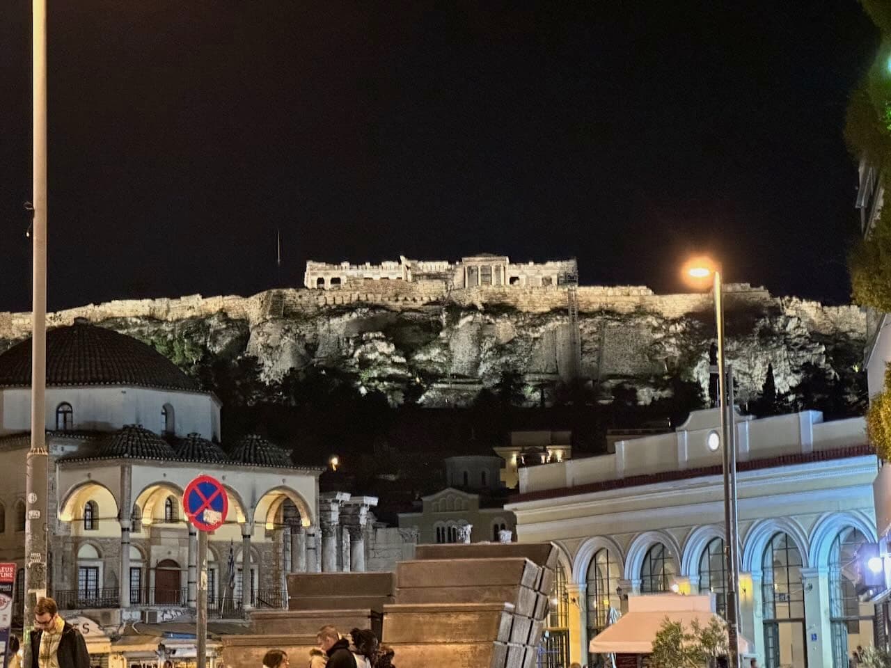 The nighttime view of the Parthenon from the streets below.