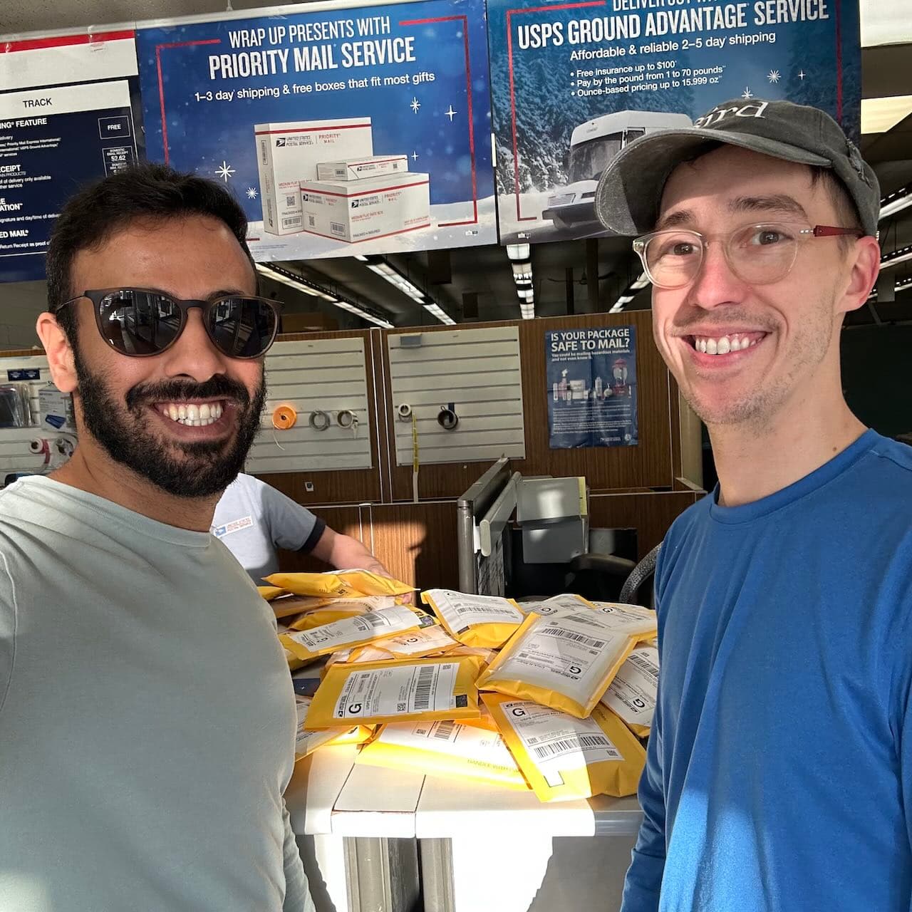 Mubark and Jeff, feeling accomplished at the post office