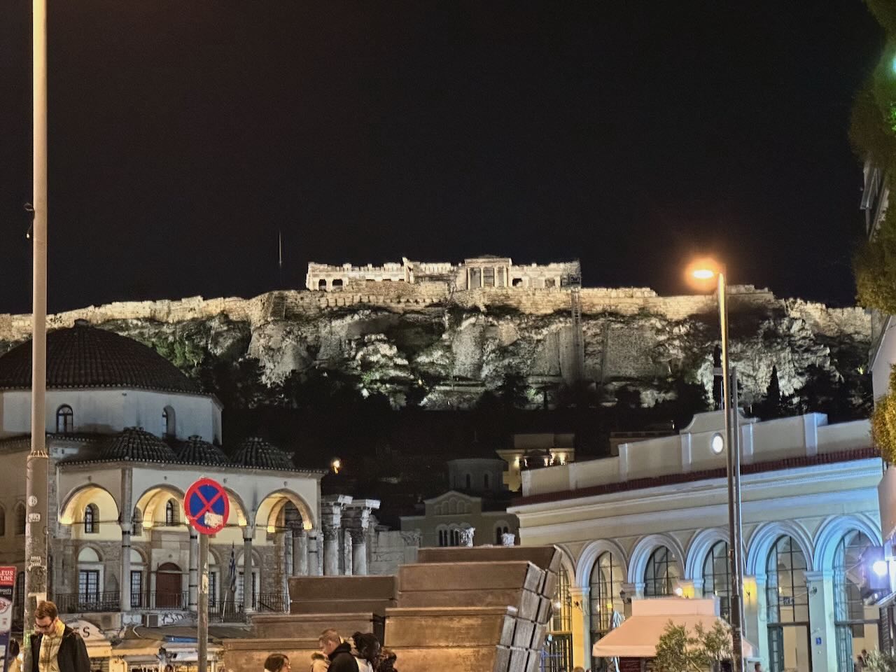 The nighttime view of the Parthenon from the streets below.