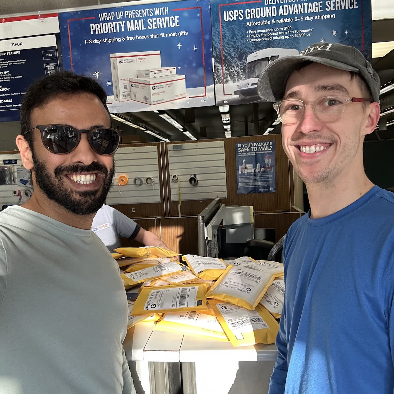 Mubark and Jeff, feeling accomplished at the post office