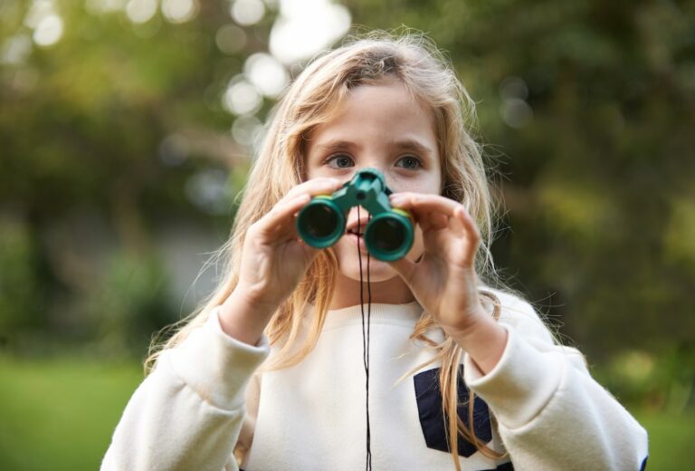 young birdwatcher with binoculars