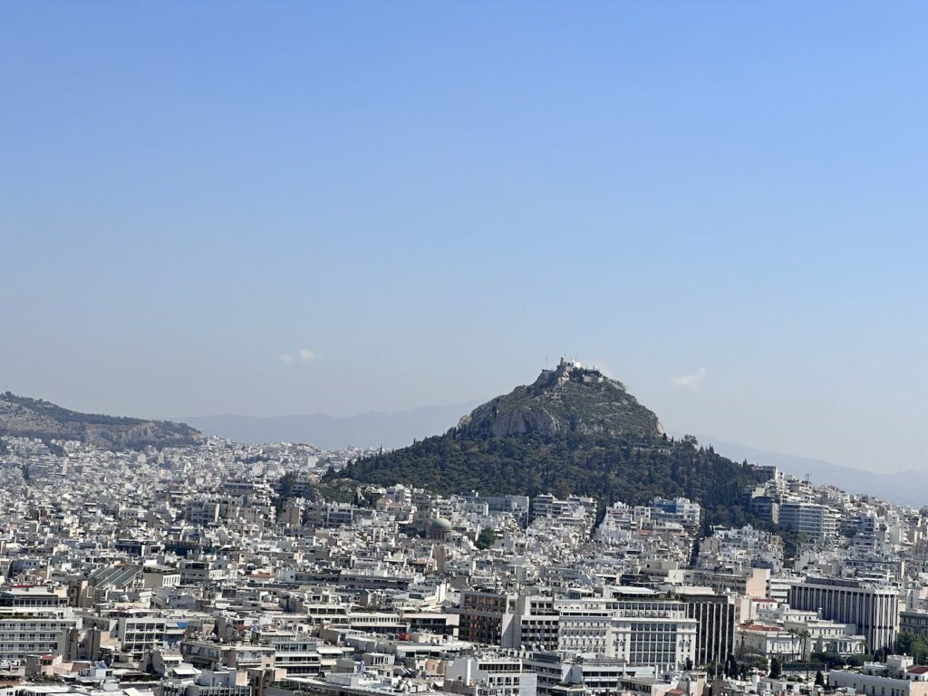 A view of Lycabettus Hill and downtown Athens from atop of the Acropolis